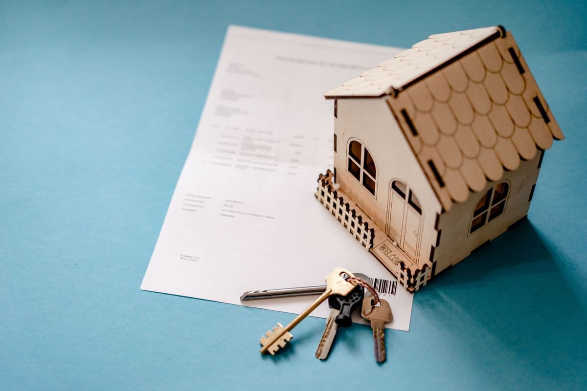 House keys atop mortgage documents