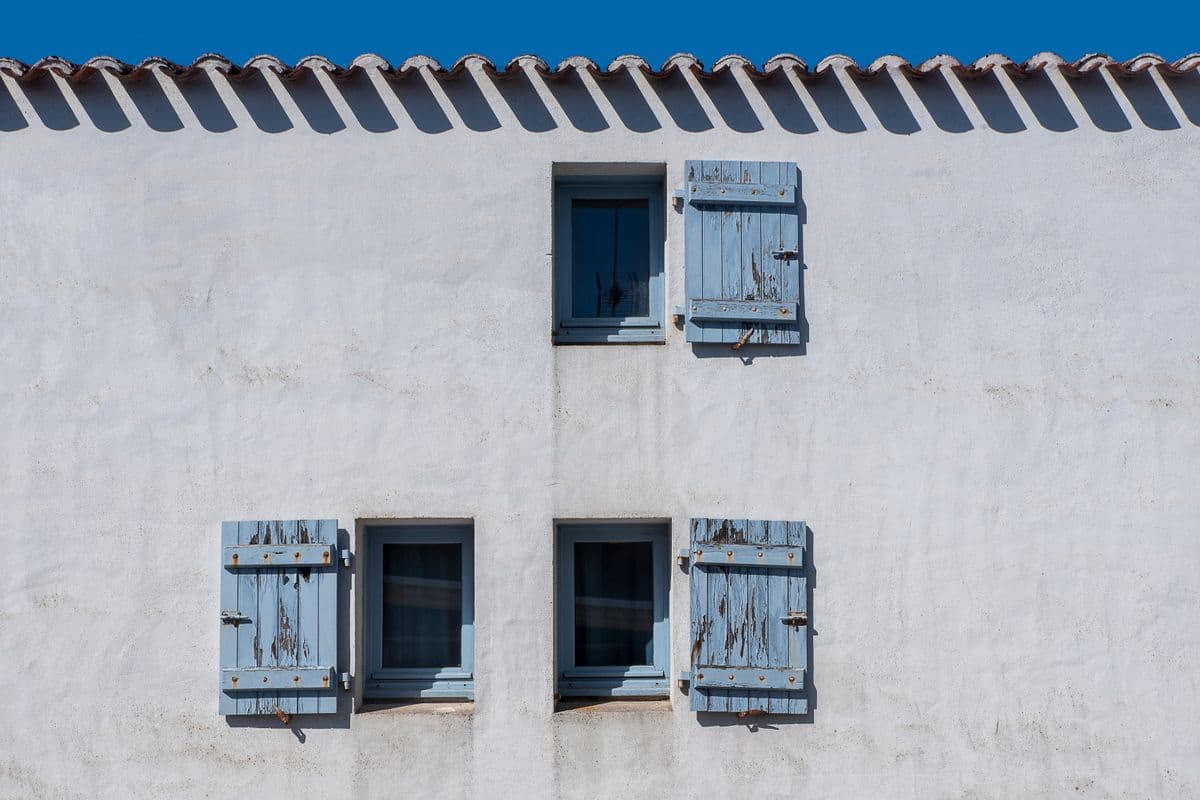 Shutters framing a home's windows